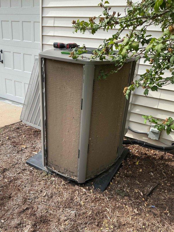 Completed comprehensive cooling season tune-up on 10-year-old outdoor condensing unit located on side of home. Performed full system inspection including electrical connections, control board functionality, and exterior cabinet condition. All components found operating within normal parameters, with control board display showing proper readings and all wire connections secure at terminal points.