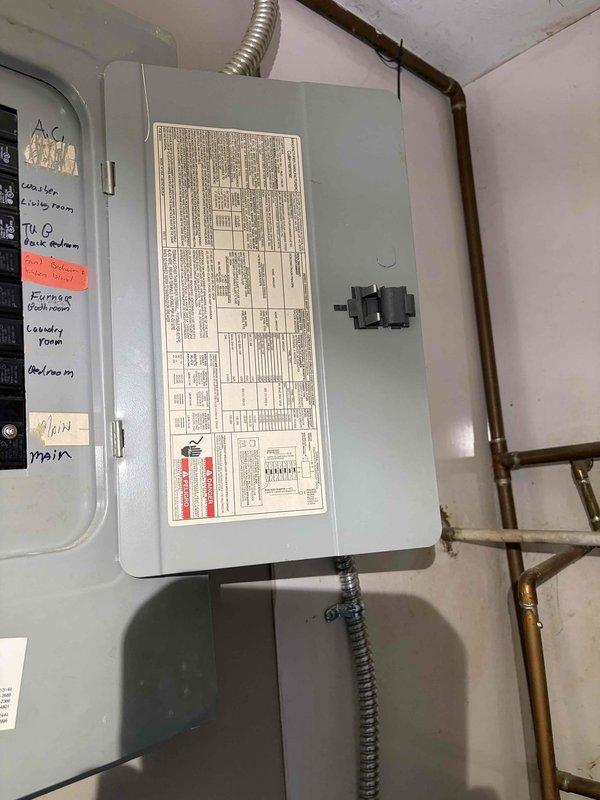 Completed electrical estimate for installation of a grounded 120V outlet in detached garage addition to accommodate new garage door opener. Assessed existing electrical panel capacity and available circuits, evaluated conduit routing from main panel to garage location, and documented current electrical infrastructure including OSB wall construction and existing wiring configuration. Provided comprehensive pricing for materials and labor to install dedicated circuit with appropriate gauge wiring, GFCI protection as required by code for garage applications, and proper grounding to support garage door operator electrical requirements.