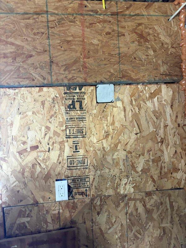 Completed electrical estimate for installation of a grounded 120V outlet in detached garage addition to accommodate new garage door opener. Assessed existing electrical panel capacity and available circuits, evaluated conduit routing from main panel to garage location, and documented current electrical infrastructure including OSB wall construction and existing wiring configuration. Provided comprehensive pricing for materials and labor to install dedicated circuit with appropriate gauge wiring, GFCI protection as required by code for garage applications, and proper grounding to support garage door operator electrical requirements.