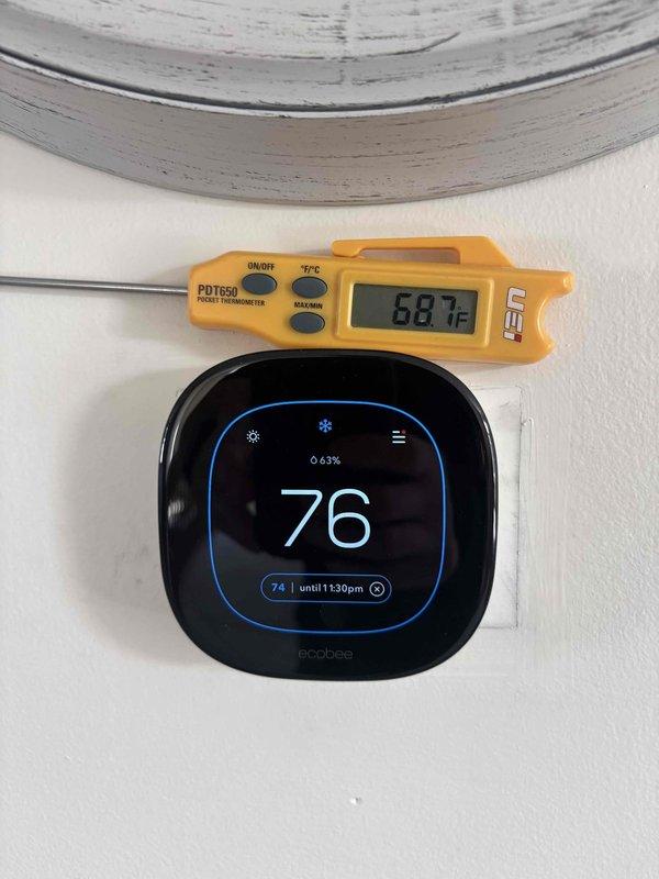Responded to callback for third-floor unit experiencing temperature control issues and high humidity readings on thermostat. Upon arrival, verified thermostat displaying inaccurate temperature differential of approximately 7°F compared to actual ambient conditions using calibrated digital thermometer. Tested and confirmed existing ecobee thermostat functionality, determined unit acceptable for reuse. Installed new 5KW heat kit, replaced drain pan by setting new pan within existing pan assembly, installed wet switch and safety switch (SS2). Replaced electrical disconnect and whip, secured components with new 2x4 and 4x4 framing materials. System tested and operational within manufacturer specifications upon completion.