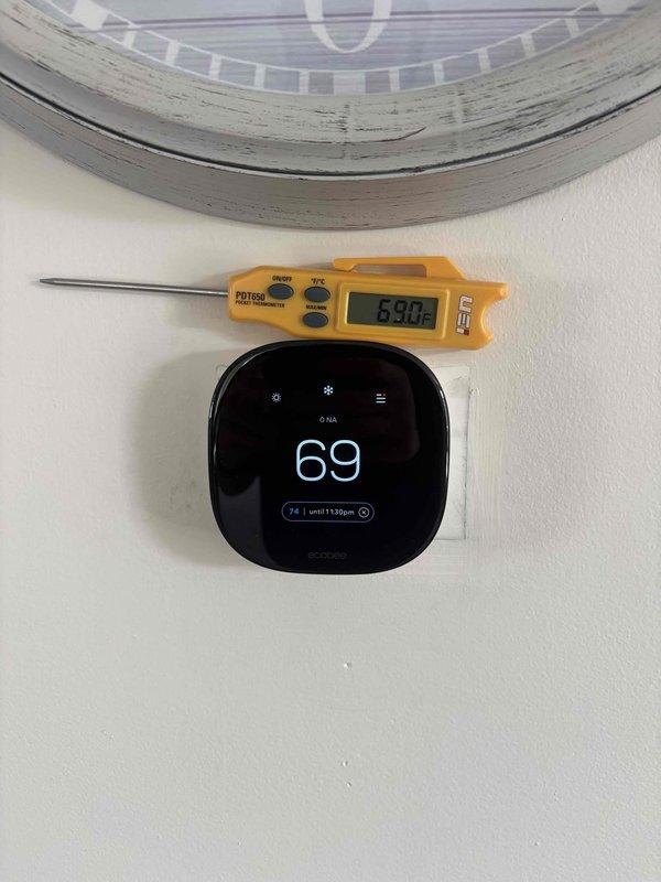 Responded to callback for third-floor unit experiencing temperature control issues and high humidity readings on thermostat. Upon arrival, verified thermostat displaying inaccurate temperature differential of approximately 7°F compared to actual ambient conditions using calibrated digital thermometer. Tested and confirmed existing ecobee thermostat functionality, determined unit acceptable for reuse. Installed new 5KW heat kit, replaced drain pan by setting new pan within existing pan assembly, installed wet switch and safety switch (SS2). Replaced electrical disconnect and whip, secured components with new 2x4 and 4x4 framing materials. System tested and operational within manufacturer specifications upon completion.