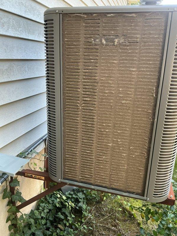 Responded to no cooling complaint on 3-year-old Lennox system. Upon arrival, found outdoor condenser unit with heavily soiled coil fins and significant debris accumulation restricting airflow. Condenser coil cleaning was performed to remove dust, dirt, and debris buildup that was preventing proper heat exchange and causing reduced cooling capacity. Cleared vegetation growth from around unit base. System tested after cleaning and verified proper operation with adequate cooling to thermostat set point.