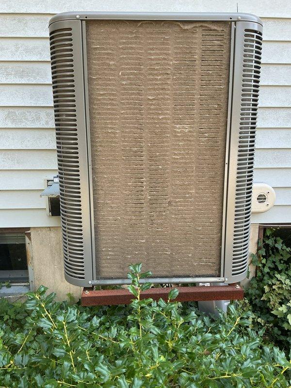 Responded to no cooling complaint on 3-year-old Lennox system. Upon arrival, found outdoor condenser unit with heavily soiled coil fins and significant debris accumulation restricting airflow. Condenser coil cleaning was performed to remove dust, dirt, and debris buildup that was preventing proper heat exchange and causing reduced cooling capacity. Cleared vegetation growth from around unit base. System tested after cleaning and verified proper operation with adequate cooling to thermostat set point.