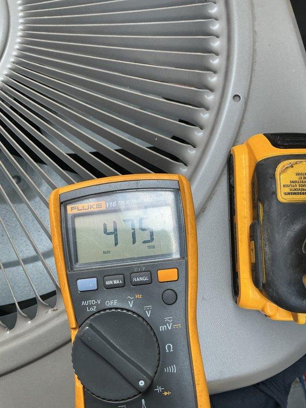 Responded to no cooling complaint for single HVAC unit located in basement. Upon inspection, performed diagnostic testing using digital multimeter on air handler components, obtaining voltage readings of 416V and 179V on system electrical components. Advised customer to shut off AC unit and leave fan running due to suspected refrigerant leak affecting whole-home cooling performance. Documented equipment condition with photos of testing procedures and air handler coil assembly for further evaluation and repair recommendations.