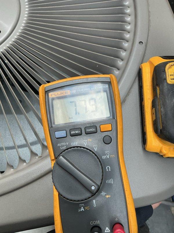 Responded to no cooling complaint for single HVAC unit located in basement. Upon inspection, performed diagnostic testing using digital multimeter on air handler components, obtaining voltage readings of 416V and 179V on system electrical components. Advised customer to shut off AC unit and leave fan running due to suspected refrigerant leak affecting whole-home cooling performance. Documented equipment condition with photos of testing procedures and air handler coil assembly for further evaluation and repair recommendations.