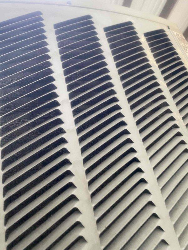 Completed comprehensive AC tune-up and maintenance inspection on residential cooling system. Performed standard preventive maintenance protocol including inspection of condenser coil, verification of system airflow through return air grille, and temperature diagnostics measuring 53.6°F at evaporator coil. Cleaned condenser fins, checked refrigerant levels, tested electrical connections, and verified proper system operation with no deficiencies noted.