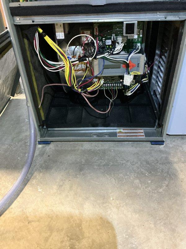 Completed preventive maintenance tune-up on residential air conditioning system under 10 years old per Home Depot service agreement. Performed comprehensive inspection of indoor air handler unit, verifying proper operation of blower motor assembly, control board functionality, and electrical connections at terminal block. Exterior condenser unit showed moderate dirt and debris accumulation on louvers and coil fins, which was cleaned to restore optimal airflow and heat transfer efficiency.