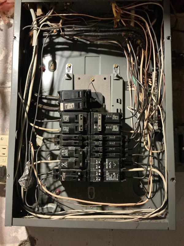 Responded to service call for multiple outlets that suddenly stopped functioning, affecting computer and television equipment. Upon arrival, conducted thorough electrical system inspection beginning with main electrical panel examination. Documented existing panel conditions showing aged residential installation with dense wiring configuration and evidence of long-term service wear.

Performed circuit breaker testing and verification to identify affected circuits. Traced power distribution from main panel to affected outlet locations. Due to accessibility constraints with furniture and equipment placement in tight spaces, utilized systematic troubleshooting approach to diagnose circuit failure without requiring extensive equipment relocation.

Inspected exterior electrical service components including weatherhead connections, service mast conduit, and meter base installation. Documented significant deterioration of exterior conduit system showing advanced rust and corrosion along verti