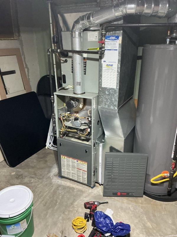 Completed comprehensive Supertune maintenance service on a 10-year-old combination AC and heat pump furnace system located at ground level in the rear of the property. Performed full system inspection with furnace cabinet opened to access and evaluate internal components including blower motor assembly, electrical connections, and mechanical operations. Conducted standard tune-up procedures on both heating and cooling systems to ensure optimal performance and efficiency for the upcoming season.