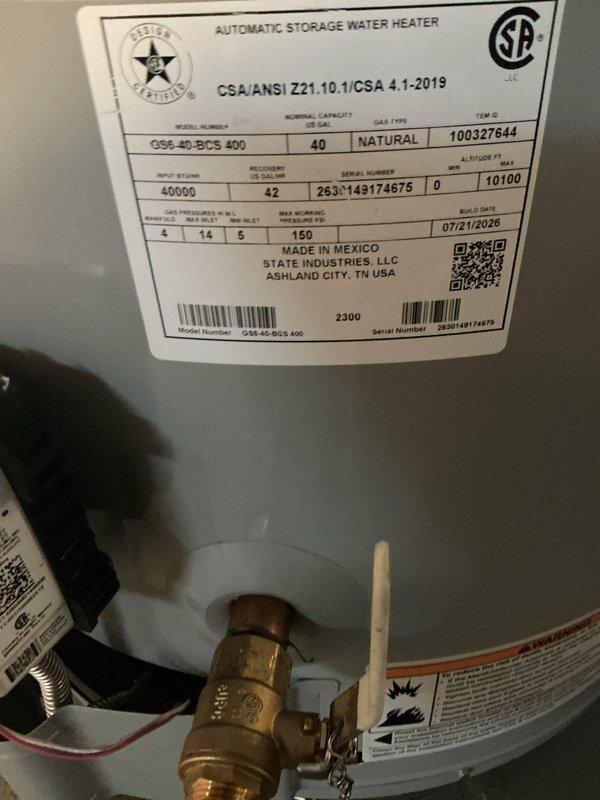 Replaced leaking 40-gallon natural gas water heater with new State Industries short model unit (G56 40-BDC5 400). Installed unit in basement utility area with proper copper piping connections, pressure relief valve, and venting. Applied permit identification sticker per permit 26plu-18140 requirements and ensured all manufacturer specifications and safety labels were properly displayed on unit.