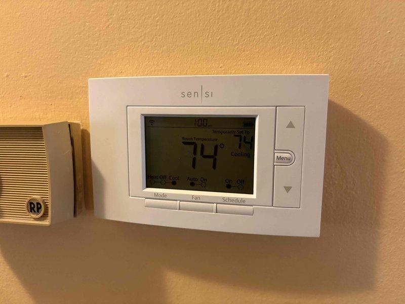 Completed comprehensive heating tune-up and safety inspection on 13-year-old residential furnace located in basement. Performed full system diagnostics, cleaned and inspected heat exchanger, verified proper combustion and gas pressure, tested all safety controls, and confirmed thermostat operation displaying 74°F with proper communication to heating system. All components found operating within manufacturer specifications with no immediate service needs identified.