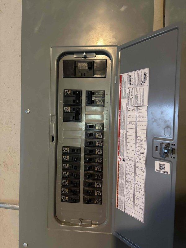 Conducted site assessment for 8-12kW generator installation at residential property. Evaluated existing electrical infrastructure including main service panel with multiple circuit breakers and available capacity for generator integration. Documented current HVAC condenser placement and exterior electrical conduit routing along building perimeter to determine optimal generator positioning and transfer switch location. Assessed site conditions including vegetation clearance requirements and concrete pad placement area near existing utility equipment. Photographed electrical panel circuit directory and exterior service area to develop comprehensive installation plan and material requirements for automatic standby generator system with required transfer switch and interconnection to main electrical service.
