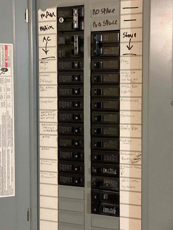 Conducted on-site electrical assessment for Kohler generator installation. Evaluated existing main electrical panel to determine compatibility and available capacity for generator integration. Panel inspection revealed fully utilized breaker spaces with handwritten circuit identification labels for main service, HVAC, kitchen appliances, garage circuits, and various room designations. Documented current electrical infrastructure including main breaker configuration, existing circuit distribution, and panel specifications to develop comprehensive installation estimate. Assessment included verification of service entrance capacity, evaluation of transfer switch placement requirements, and determination of necessary electrical modifications to accommodate automatic standby generator system.