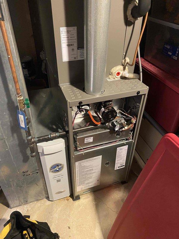 Completed comprehensive super tune maintenance on residential HVAC system consisting of one furnace unit (under 10 years old, basement installation) and one air conditioning unit (side yard location). Performed full system diagnostics including electrical testing with digital multimeter, verified proper voltage readings, inspected blower motor assembly and internal components with cabinet access, checked all mechanical connections and wiring harnesses, examined ductwork connections, and assessed auxiliary air purification equipment. All equipment operating within manufacturer specifications with no deficiencies noted.