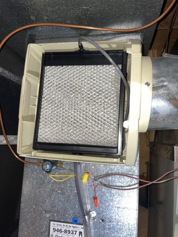 Replaced maintenance kit on humidifier unit including new filter pad and associated hardware. Unit tested and confirmed operational with proper water flow and electrical connections verified. System returned to normal heating and cooling operation.