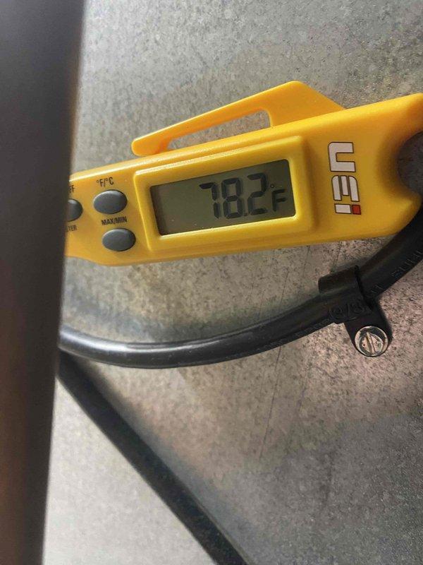Replaced thermostat at customer's residence per management authorization. Disconnected existing thermostat wiring from terminal block, removed old unit from wall, and installed new thermostat with proper wire connections to RC, RH, O/B, Y, G, W/E, and C terminals. Verified system operation and temperature readings using calibrated digital thermometer, confirming proper HVAC functionality upon completion.