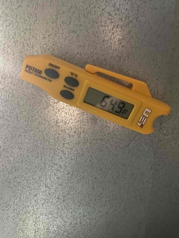Responded to no cooling complaint on 10+ year old AC unit located on side of home that had been shut down following previous appointment. Upon arrival, accessed thermostat display and verified system status. Conducted temperature diagnostics using calibrated digital thermometer, recording ambient reading of 54.2°F to establish baseline conditions. Evaluated system operation and determined root cause of cooling failure.