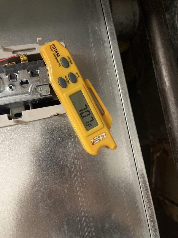 Responded to complaint of loud humming/buzzing noise from outside Lennox condensing unit approximately 1 year old. Upon arrival, performed system diagnostics and temperature measurements. Verified supply air temperature at 42°F at interior register and measured return air temperature at 87.2°F, confirming proper temperature split and system cooling operation. Inspected outdoor unit for source of abnormal noise, checked electrical connections, contactor operation, and compressor function. System operating within normal parameters at time of inspection with acceptable airflow and refrigerant performance indicated by temperature readings.