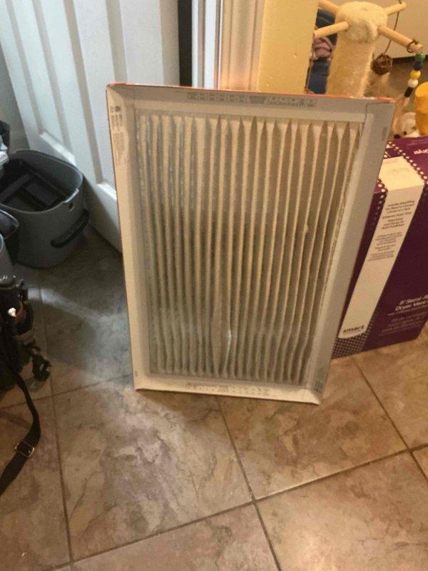 Responded to service call for 3-year-old Lennox AC unit not cooling with frozen refrigerant lines and indoor temperature at 89°F. Upon inspection, identified severely restricted airflow due to heavily soiled air filter causing evaporator coil to freeze. Removed and photographed dirty filter showing significant dust and debris accumulation. Replaced filter with new unit, allowed system to thaw completely, and restored normal operation with proper cooling throughout residence.