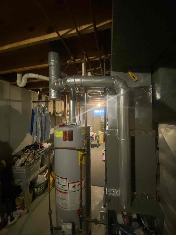 Completed heating maintenance tune-up on a 9-year-old furnace system. Performed comprehensive inspection of all heating components, verified proper system operation, and took electrical voltage readings using diagnostic meter showing 359V AC. System was found to be functioning properly with no issues identified during the preventative maintenance service.
