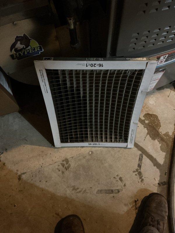 Responded to no-cool complaint on residential cooling system under 10 years old. Upon arrival, found severely restricted airflow due to dirty air filter. Removed and photographed heavily clogged 16x20x1 filter from return air system. Inspected blower compartment and internal components through access panel, confirming adequate airflow after filter replacement. System restored to normal cooling operation.