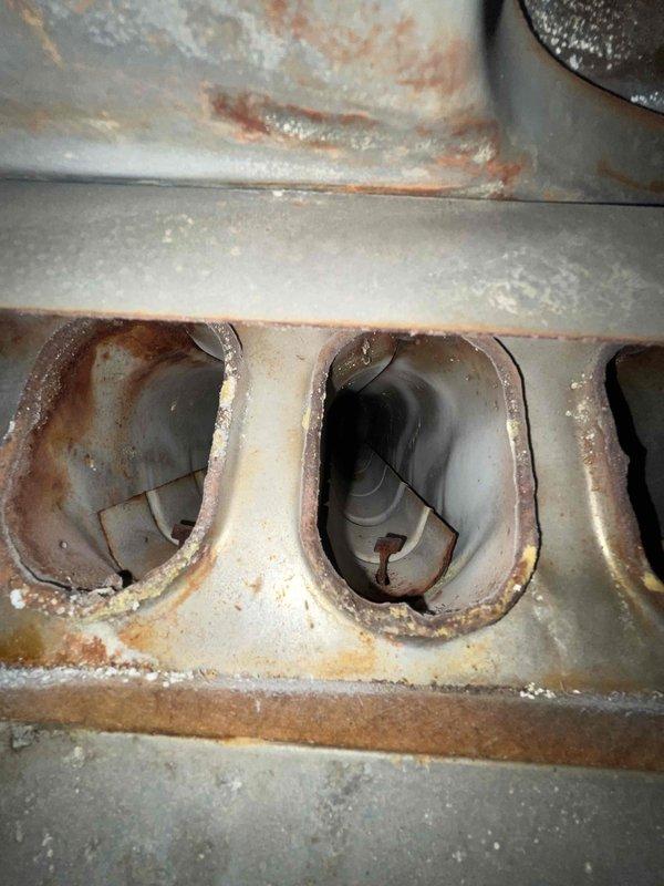 Completed comprehensive HVAC tune-up and maintenance on air conditioning and furnace system per Home Depot service agreement. Performed standard maintenance procedures including filter replacement with new Filterbuy filters, system inspection, and performance evaluation. Heat exchanger inspection revealed significant rust and corrosion around burner assembly ports with mineral deposits present, indicating age-related deterioration that should be monitored for future service needs.