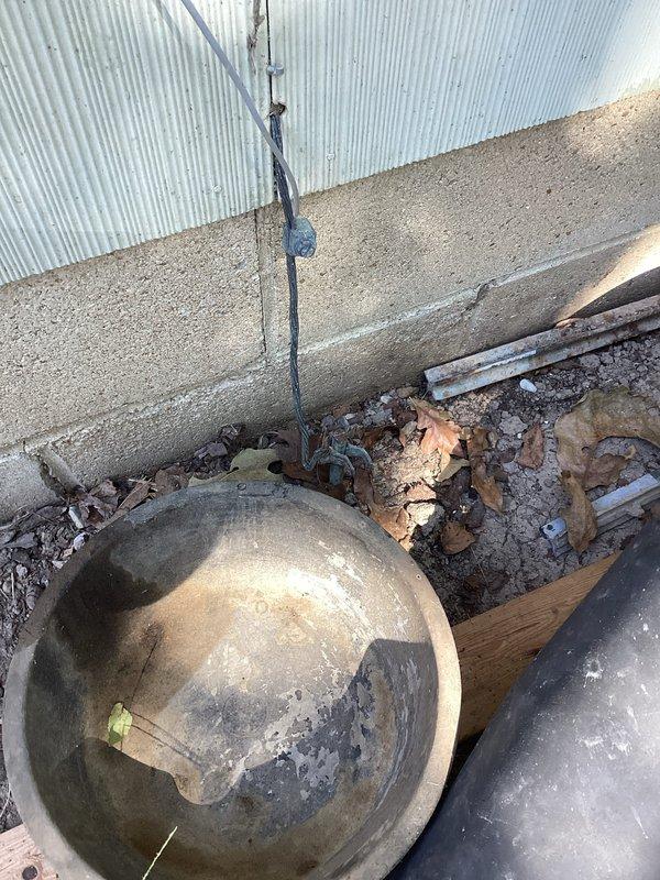 Conducted on-site evaluation of existing fused electrical panel in garage. Customer reported voltage drop issues with lights dimming when high-draw appliances such as air conditioning units operate, indicating inadequate circuit protection and outdated electrical distribution system. Inspected existing 8-12 circuit fuse panel and exterior service entrance components. Documented current electrical infrastructure including exterior meter base, service conduit, and panel location. Prepared comprehensive estimate for complete panel upgrade from obsolete fuse-type panel to modern circuit breaker panel with adequate amperage capacity to meet current electrical demands and code requirements.