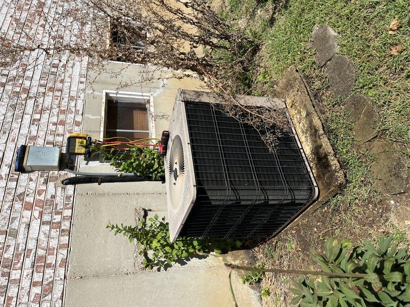 Responded to no-cool service call for residential AC system unable to maintain temperature below 81 degrees. Upon arrival, performed comprehensive system diagnostic on outdoor condensing unit and indoor air handler. Inspected evaporator coil assembly, which showed moderate dust accumulation and signs of aging but remained structurally intact. Verified refrigerant line connections at compressor and accumulator, noting copper piping displayed oxidation consistent with system age. Examined electrical connections including control wiring and confirmed proper terminations at disconnect box. Assessed condenser unit positioned on exterior concrete pad with visible debris accumulation on top grille and surrounding area. Documented overall system condition showing wear patterns typical of older equipment, including dirt buildup on internal components, weathered housing surfaces, and environmental exposure. Verified unit accessibility and operational status following customer instruction to keep