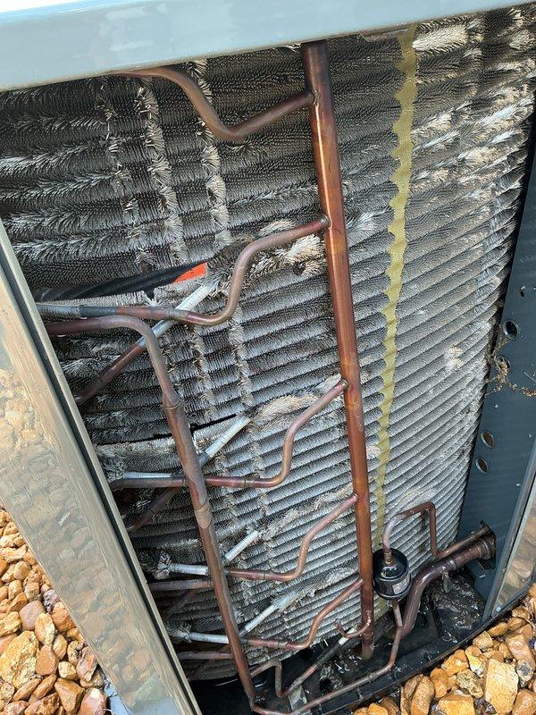 Completed comprehensive tune-up and preventative maintenance on a 10+ year old residential air conditioning system. Performed thorough inspection of evaporator coil assembly, noting accumulated dirt and weathering on fins consistent with outdoor exposure and system age. Inspected copper refrigerant lines for integrity and proper routing across coil assembly. Removed and evaluated air filter, which showed significant dust and particulate accumulation in pleated media, confirming need for replacement. System confirmed operational with no reported issues prior to service.
