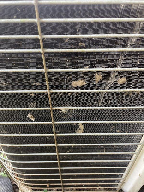 Replaced condenser fan motor and blade on outdoor HVAC unit due to motor failure. Performed thorough cleaning of heavily soiled condenser coil, removing significant accumulation of dirt, dust, and outdoor debris that had built up between the fins and was restricting airflow. Unit restored to proper operating condition with improved heat exchange efficiency.