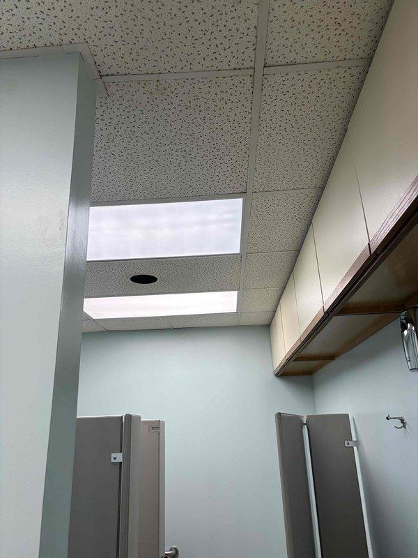 Completed scheduled HVAC maintenance on commercial cooling system serving restroom facility. Inspected air distribution components, ceiling-mounted ventilation equipment, and thermostat controls to ensure proper operation and temperature regulation throughout the space.