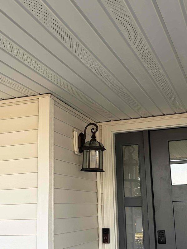 Completed comprehensive site assessment for outdoor lighting installation estimate. Evaluated existing front porch decorative wall-mounted lantern fixture with scrollwork design and assessed electrical service infrastructure including meter base, disconnect box, and associated conduit routing. Documented current conditions of exterior lighting system and electrical service equipment to provide accurate scope and specifications for proposed outdoor lighting upgrades.