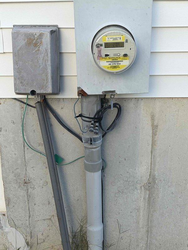 Completed comprehensive site assessment for outdoor lighting installation estimate. Evaluated existing front porch decorative wall-mounted lantern fixture with scrollwork design and assessed electrical service infrastructure including meter base, disconnect box, and associated conduit routing. Documented current conditions of exterior lighting system and electrical service equipment to provide accurate scope and specifications for proposed outdoor lighting upgrades.
