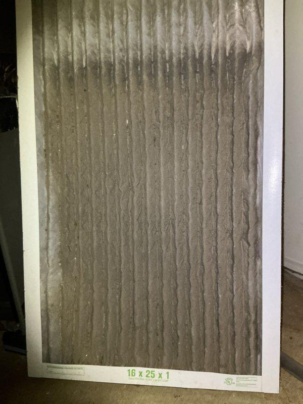 Performed comprehensive cooling system tune-up on 2-year-old Lennox air conditioning unit with warranty valid through April 2027. Inspected and evaluated 16x25x1 air filter showing moderate dust accumulation; checked refrigerant lines, electrical connections, and condenser unit exterior condition. System operating within normal parameters with no deficiencies noted; unit well-maintained with clean exterior casing and proper mounting on pad.