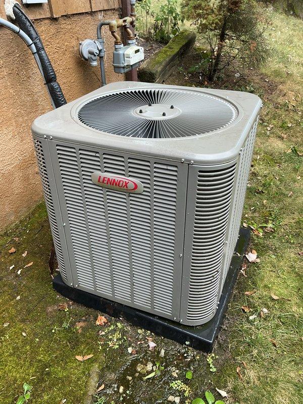 Performed comprehensive cooling system tune-up on 2-year-old Lennox air conditioning unit with warranty valid through April 2027. Inspected and evaluated 16x25x1 air filter showing moderate dust accumulation; checked refrigerant lines, electrical connections, and condenser unit exterior condition. System operating within normal parameters with no deficiencies noted; unit well-maintained with clean exterior casing and proper mounting on pad.