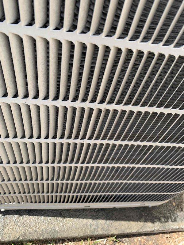 Performed comprehensive cooling system tune-up on 15-year-old outdoor AC unit. Conducted electrical diagnostics using clamp meter, recording voltage and amperage readings to verify proper system operation. Inspected and cleaned condenser coil fins, which showed good condition with minimal debris accumulation. Unit operating within normal parameters with no deficiencies noted at time of service.