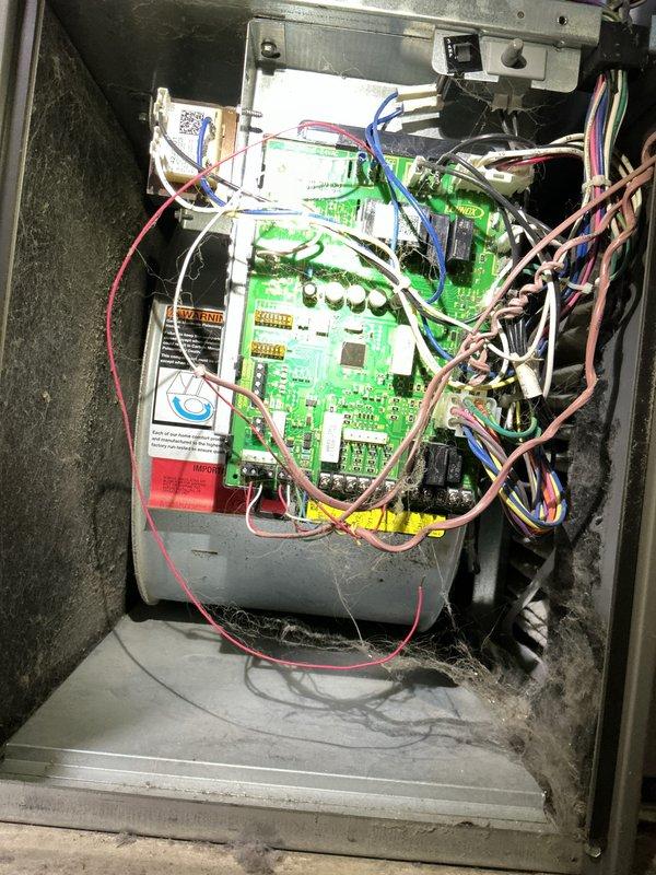 Completed preventative maintenance tune-up on a 4-year-old air conditioning system located in basement mechanical room. Performed comprehensive system inspection including electrical control board examination, verified all wire connections and relay operations, and documented control panel condition. Inspected and documented heavily soiled air filter showing significant dust and debris accumulation on pleated media, indicating proper filtration but requiring replacement for optimal airflow and system efficiency.