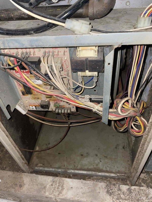 Completed comprehensive Supertune maintenance service on a 10-year-old split system with furnace located in basement and AC unit in backyard. Performed full system inspection, cleaned and serviced all accessible components including blower assembly, draft inducer motor, and electrical connections. Verified proper operation of both heating and cooling systems, documented equipment condition with interior component photography showing normal wear consistent with age, and ensured all safety controls and wiring connections were secure and functioning properly.
