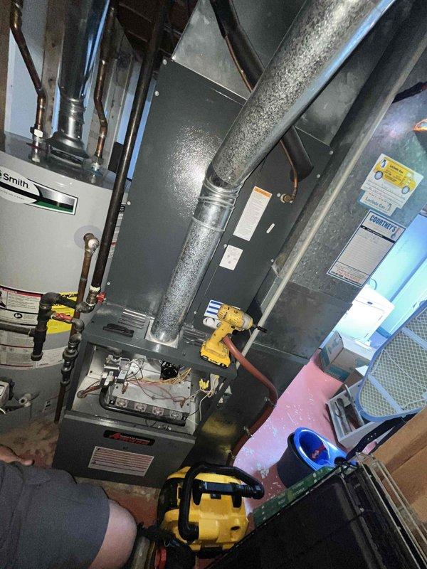 Completed comprehensive supertune maintenance on residential HVAC system located in basement mechanical room. System is over 10 years old and includes furnace unit with associated ductwork and air handling components. Performed full system inspection, replaced air filters with new FILTERBUY pleated media filters, checked all electrical connections and controls, verified proper airflow through supply and return ducts, inspected condensate drainage, and tested thermostat operation. Examined refrigerant lines and insulation for integrity, cleaned blower assembly, and verified all safety controls were functioning properly. System operating within manufacturer specifications upon completion of maintenance procedures.