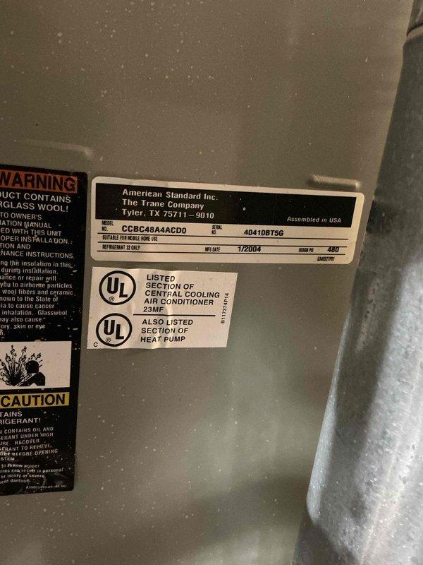 Responded to no-cool call on 22-year-old Trane system (Model CCBC48A4ACD0) experiencing repeated freeze-ups. Upon arrival, confirmed system was manufactured in 2004 and evaluated operational parameters using digital manifold gauges. Measured superheat at 59.2°F, indicating severely restricted refrigerant flow or low charge condition. Subcooling reading of 12.7°F and pressure readings of 52.9 PSI high-side and 28.95 PSI low-side confirmed inadequate refrigerant charge in the system. Given the age of the unit and the freeze-up symptoms, likely causes include refrigerant leak, restricted metering device, or compromised airflow across the evaporator coil. Documented system nameplate information and current operating conditions with photos for service records. Advised customer of findings and recommended options for repair versus replacement given the system's age exceeding typical equipment lifespan.