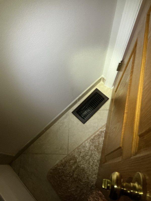 Responded to complaint of uneven cooling with upstairs areas remaining warmer than main floor. Performed comprehensive airflow evaluation throughout residence, measuring supply register outputs on both levels to identify distribution imbalances. Inspected basement ductwork system for accessibility and evaluated feasibility of installing manual balancing dampers to redirect increased airflow to upper level. Assessed upstairs return air pathways and grille sizing to determine adequacy of return airflow from second floor. Documented existing floor register locations and measured current air velocities at multiple supply points. Provided recommendations for duct modifications to improve thermal comfort and temperature consistency between floors.