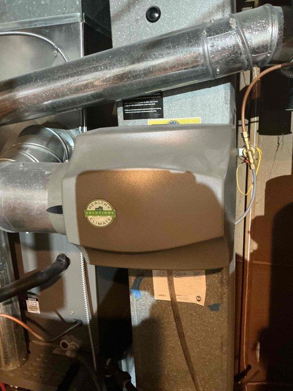 Completed routine furnace tune-up on basement-located air handler unit. Performed comprehensive system inspection including visual assessment of ductwork connections, condensate drain lines, and electrical components. Filter inspected and found in acceptable condition with minimal debris accumulation. All mechanical connections, including galvanized supply ductwork and refrigerant lines, verified secure and properly sealed. System operational and functioning within normal parameters upon completion of maintenance service.