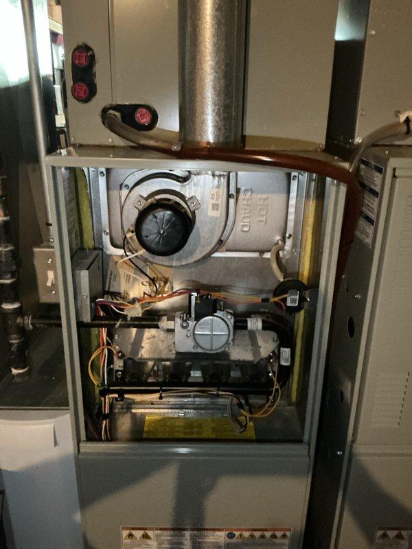 Completed preventive maintenance tune-up on two HVAC units located in basement. Performed comprehensive inspection of both systems including burner assembly, blower motor, heat exchanger, gas valves, ignition components, and all electrical connections. Verified thermostat operation and calibration, inspected flue pipe and venting system, checked all safety controls, and ensured proper system operation on both units.