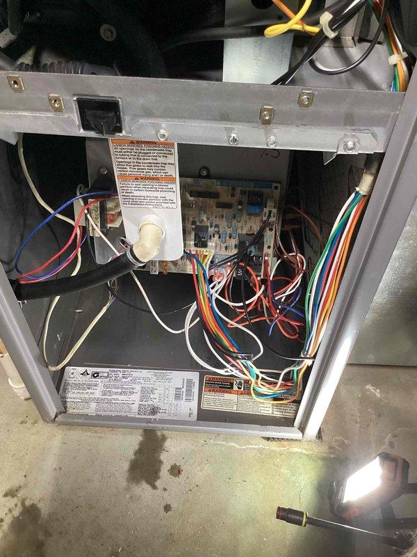 Replaced defective blower motor and wheel assembly on ICP furnace system. Removed old components, installed new blower motor and wheel, verified proper electrical connections to control board, and tested system operation. Supply air temperature confirmed at 71.2°F with unit operating normally.