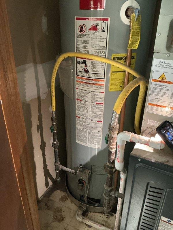 Completed installation of two 40-gallon gas water heaters at residential property—one blanket-insulated unit installed upstairs and one tall unit installed in basement. Connected gas supply lines, water piping, and venting systems to manufacturer specifications, applied required plumbing identification stickers, and obtained permits 26PLU-18424 and 26PLU-18423 for both installations to ensure code compliance.