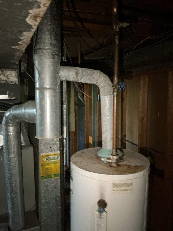 Completed installation of two 40-gallon gas water heaters at residential property—one blanket-insulated unit installed upstairs and one tall unit installed in basement. Connected gas supply lines, water piping, and venting systems to manufacturer specifications, applied required plumbing identification stickers, and obtained permits 26PLU-18424 and 26PLU-18423 for both installations to ensure code compliance.