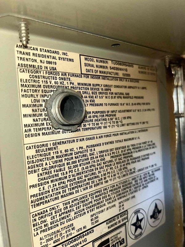Performed second opinion inspection on American Standard/Trane furnace model TUD2A0B948K9 located in basement. Verified previous diagnosis of cracked heat exchanger and water damage to evaporator coil through visual inspection and documentation. Photographed data plate specifications and internal components to confirm equipment condition and support findings.