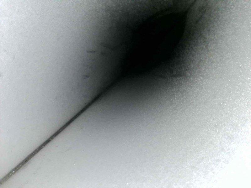Performed second opinion inspection on American Standard/Trane furnace model TUD2A0B948K9 located in basement. Verified previous diagnosis of cracked heat exchanger and water damage to evaporator coil through visual inspection and documentation. Photographed data plate specifications and internal components to confirm equipment condition and support findings.