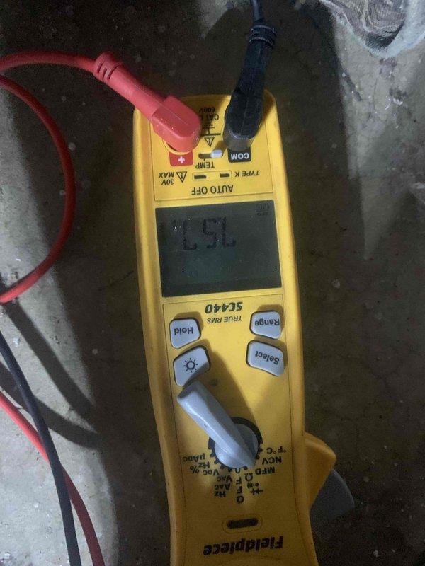 Completed comprehensive tune-up service on a 12-year-old split system including outdoor AC condenser unit and basement furnace. Performed standard maintenance procedures on both units, inspected condenser coil fins and protective grille for proper airflow, and conducted electrical diagnostics using digital multimeter to verify system voltage and amperage readings. All components found operating within normal parameters, and both units tested successfully upon service completion.