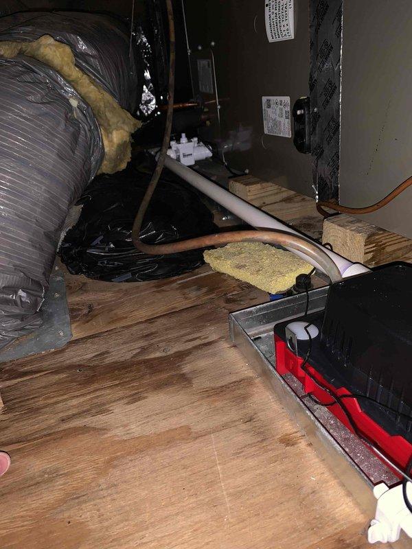 Replaced defective 3/4" PVC condensate drain line in attic and installed new low-profile condensate pump to ensure proper drainage from air handler unit. Removed and disposed of old drain line components, routed new PVC piping with proper pitch and slope, and connected pump to system. System tested and confirmed operational with heating and cooling functions performing as expected.